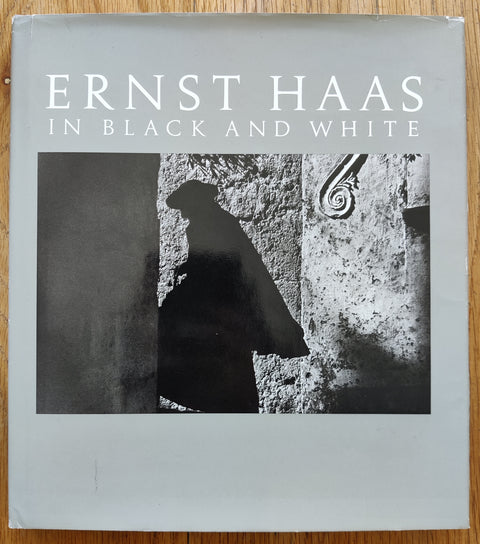 The photobook cover of Ernst Haas In Black And White by Ernst Haas. in dust jacketed hardcover grey.