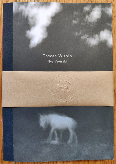 The photography book cover of Traces Within by Eva Voutsaki. Paperback in B&W with sketchy image of a horse on the cover. Signed.