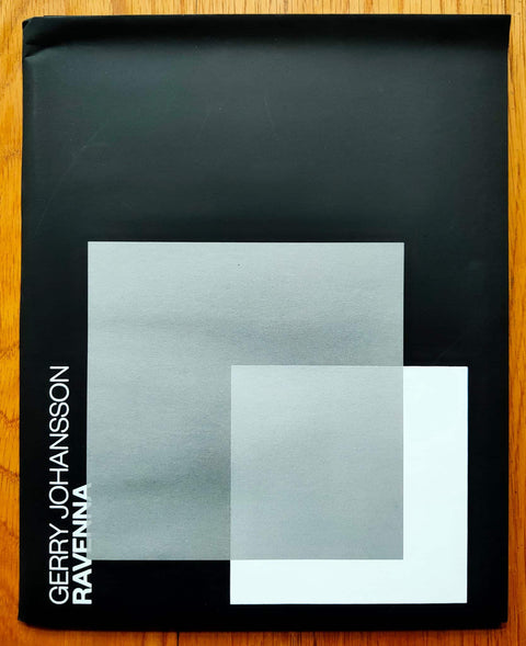 The photography book cover of Ravenna by Gerry Johansson. Paperback in black with 2 large overlapping squares. Signed.