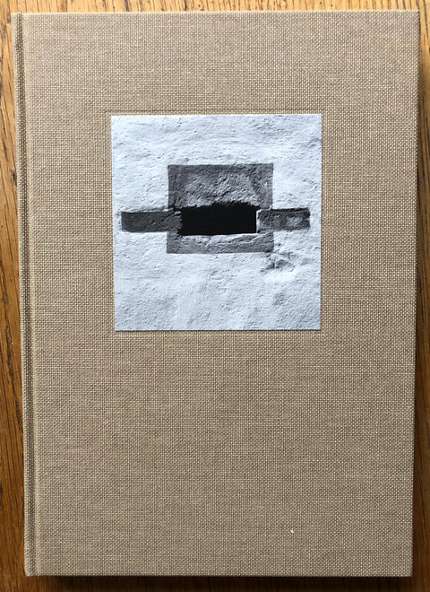 The photography book cover of Supplement: Deutschland by Gerry Johansson. Hardback in beige with white, grey and black image in centre. Signed.