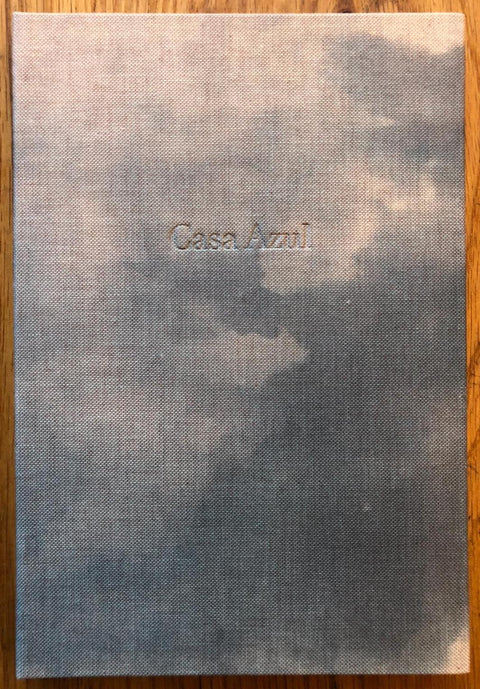 The photography book cover of Casa Azul by Giulia Iacolutti. Hardback with dark cloudy cover.
