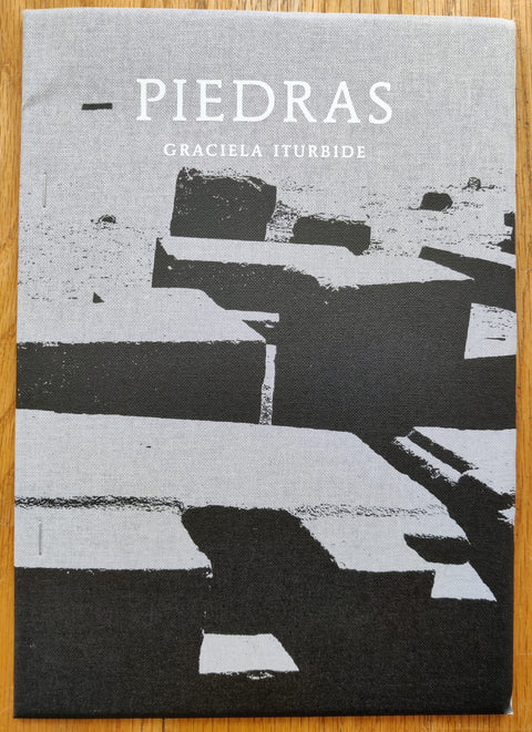 The photography book cover of Piedras by Graciela Iturbide. In softcover black and white.