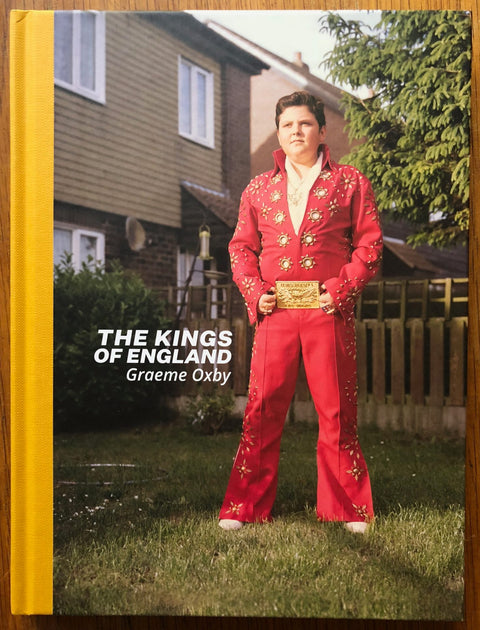 The photography book cover of The Kings of England by Graeme Oxby. Hardback with yellow spine.
