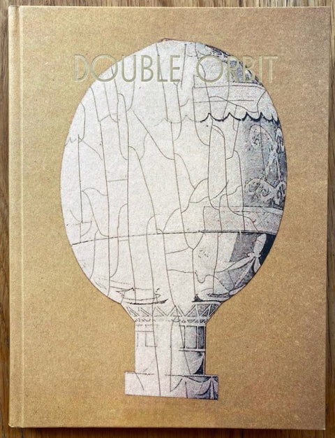 The photography book cover of Double Orbit by Gregoire Pujade-Lauraine. Hardback in brown. Signed.