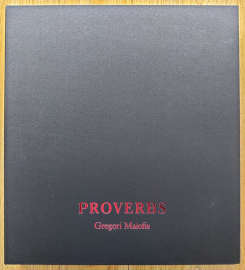 The photobook cover of the special edition of Proverbs of Gregori Maiofis. With a signed limited edition print and a signed copy of the book.