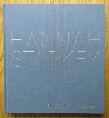 The photography book cover of Photographs 1997 - 2017 by Hannah Starkey. Hardback in blue with silver text.