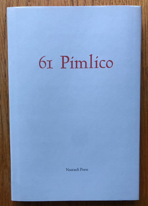 The photography book cover of 61 Pimlico by Henry Hayler. Paperback in white with red title. Signed.