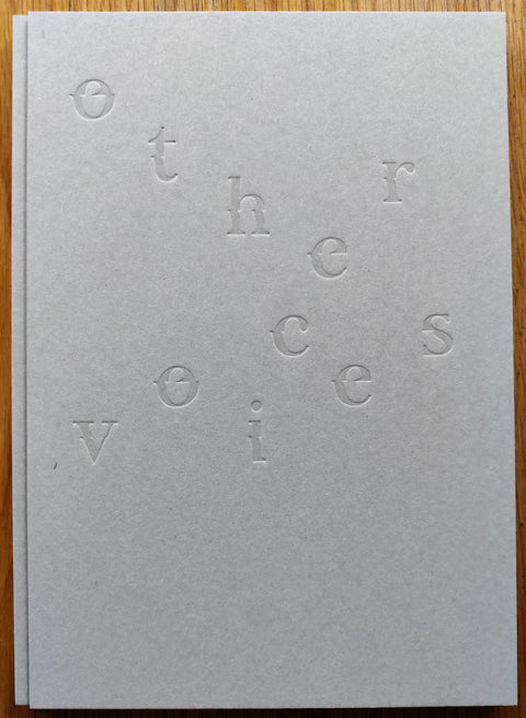 The photobook cover of Other Voices by Hideyuki Ishibashi. Hardback in white with zig zag style title.