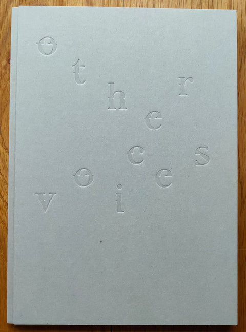 The photobook cover of Other Voices by Hideyuki Ishibashi. Hardback in white with zig zag title. 