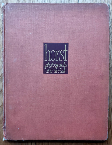 The photography book cover of Horst: Photographs of a Decade by Horst P Horst. Hardback in red.