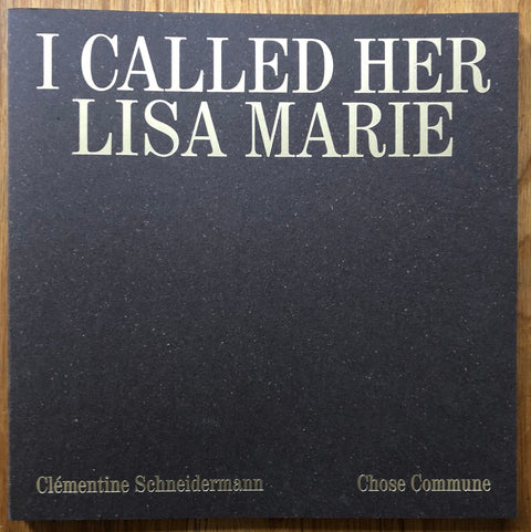 The photography book cover of I Called Her Lisa Marie by Clementine Schneidermann. Paperback black with white speckles.