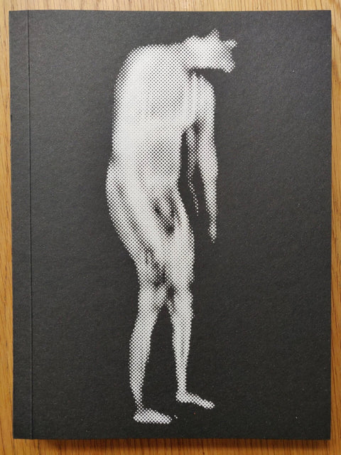 The photobook cover of Deceitful Reverence by Igor Pisuk. Paperback with image of a nude man on the cover. Signed.