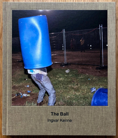 The photography book cover of The Ball by Ingvar Kenne. Hardback with image of a blue bin over someones head.