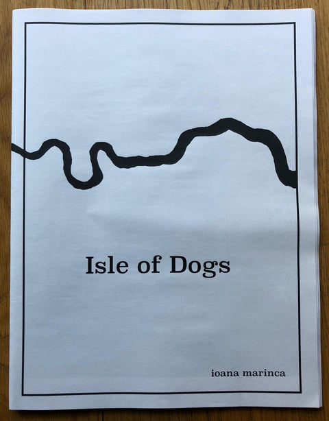 The photography book cover of Isle of Dogs by Ioana Marinca. Paperback newspaper style in white. Signed.