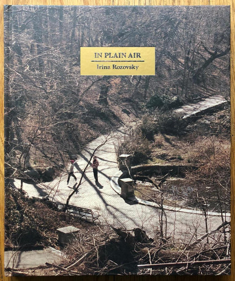The photography book cover of In Plain Air by Irina Razovsky. Hardback image of a path through the woods. Signed.