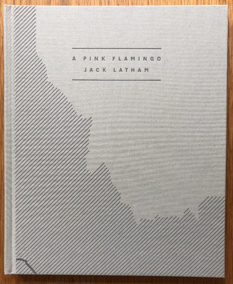 The photography book cover of A Pink Flamingo by Jack Latham. Hardback grey.