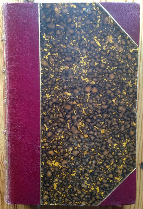 The book cover of Mansfield Park by Jane Austen. Hardback with red leather binding.