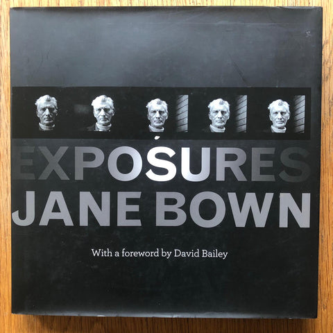 The photography book cover of Exposures by Jane Bown. Hardback in black with 5 small images of a man's face. Signed.