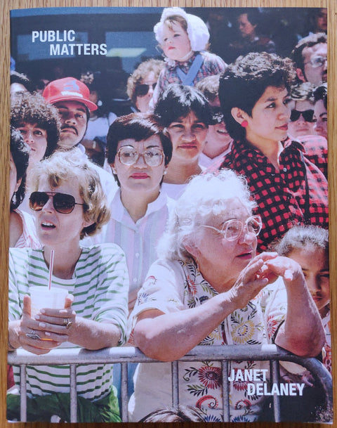 The photography book cover of Public Matters by Janet Delaney. Paperback with image of a crowd of people. Signed.