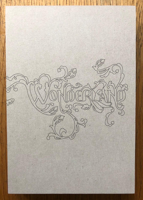 The photography book cover of Wonderland: A Fairy Tale of the Soviet Monolith by Jason Eskenazi. Hardback in beige with purple spine. Signed.