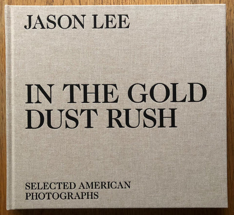 The photography book cover of IN THE GOLD DUST RUSH by Jason Lee. Hardback in beige.