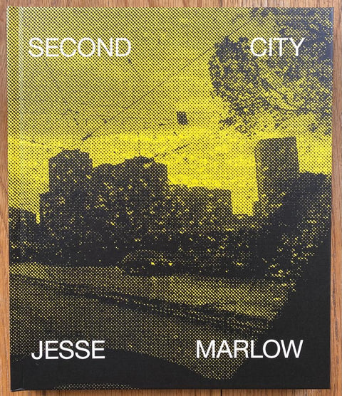 The photography book cover of Second City by Jesse Marlow. Hardback in yellow. Signed.