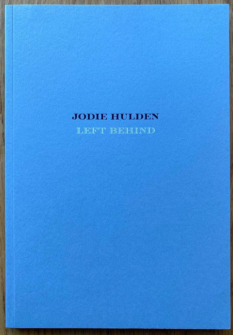The photography book cover of Left Behind by Jodie Hulden. Paperback in light blue. Signed.