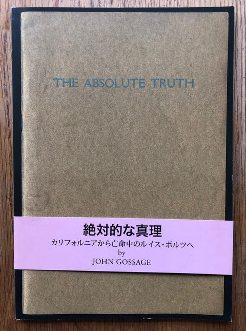 The photography book cover of The Absolute Truth by John Gossage. Paperback in brown with pink band.