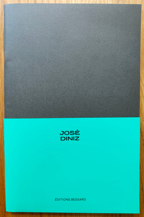 The photography book cover of The Sea: Time & Movement by Jose Diniz. Paperback with half turquoise half black cover. Signed.