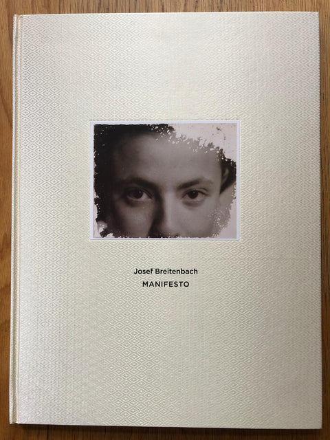 The photography book cover of Manifesto by Josef Breitenbach. Hardback cream cover with diamond pattern.