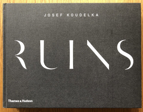 The photography book cover of Ruins by Josef Koudelka. Hardback in black.