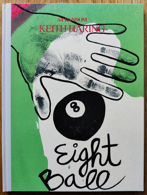 The art book of Keith Haring: Eight Ball (Art Random Series) by Keith Haring. In hardcover green and white and red with an 8 ball.