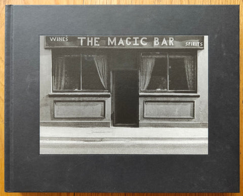 The photography book cover of The Magic Bar by Kenneth Gustavsson. Hardback in black with image of the magic bar.