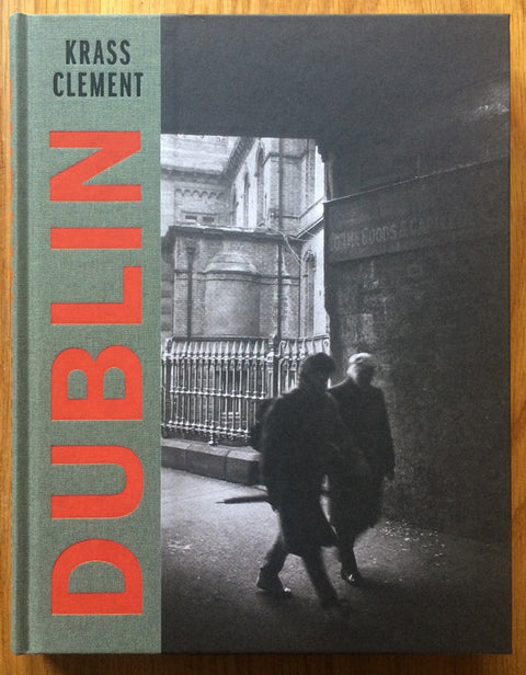 The photography book cover of Dublin by Krass Clement. Hardback black and white photograph with red title.