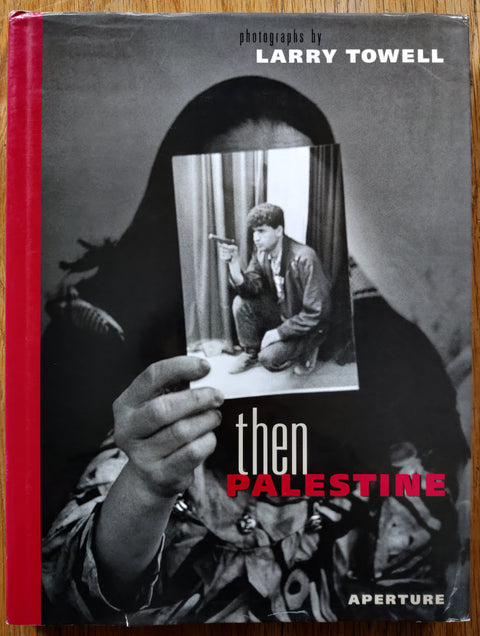 The photography book cover of Then Palestine by Larry Towell. In dust jacketed hardcover black.