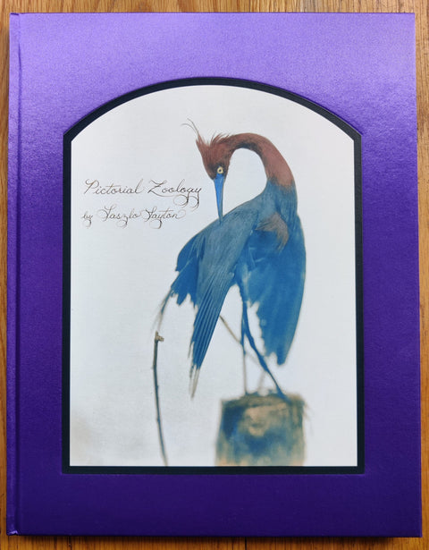 The photography book cover of Pictorial Zoology by Laszlo Layton. Hardback in shiny purple.
