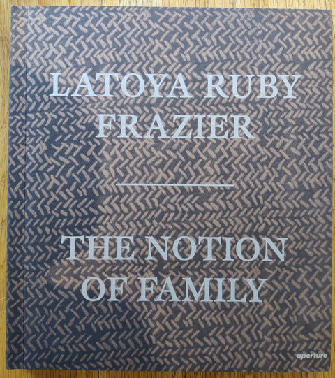 The photobook cover of The Notions of Family by Latoya Ruby Frazier. In softcover brown.