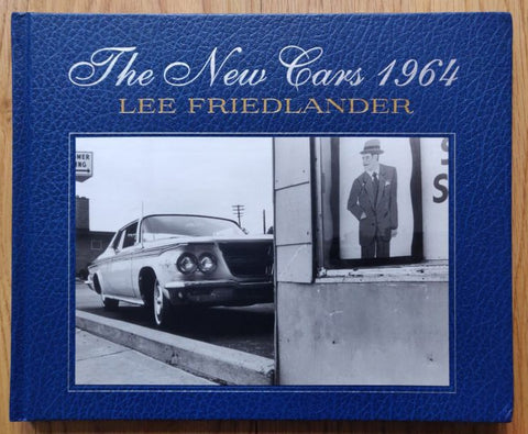The photography book cover of The New Cars 1964 by Lee Friedlander. Hardback in blue with B&W image of an old car on the cover.