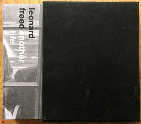 The photography book cover of Another Life by Leonard Freed. Hardback in B&W with black slipcase cover.