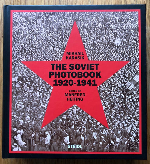 The photography book cover of The Soviet Photobook 1920-1941 by Manfred Heiting and Mikhail Karasik. Hardback with a red star on the front.