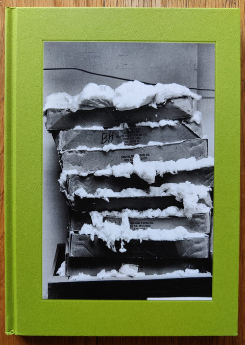 The photobook cover of Cotton by Mark Cohen. In hardcover green.