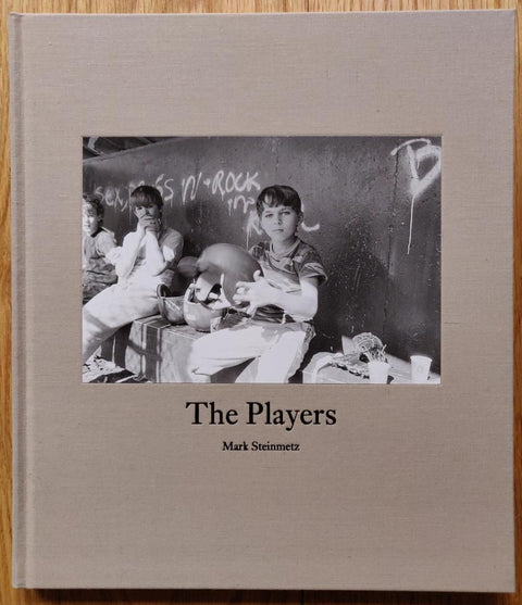 The photography book cover of The Players by Mark Steinmetz. In hardcover beige. Signed.