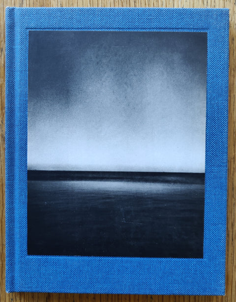 The photobook cover of Ocean by Martin Bogren. In hardcover blue. Signed