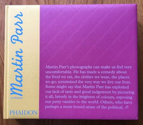 The photography book cover of Martin Parr by Martin Parr and Val Williams. Hardback purple, yellow and blue cover.