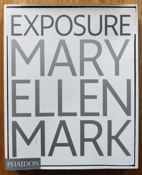 The photobook cover of Mary Ellen Mark: Exposure. In dust jacketed softcover white. 