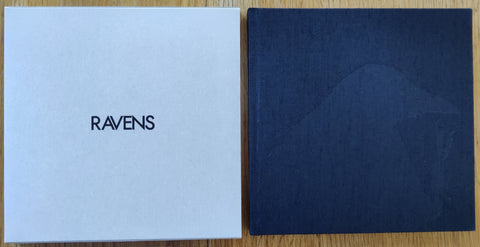 The photobook cover of Solitude of Ravens by Masahisa Fukase. In hardcover black in a grey slipcase.