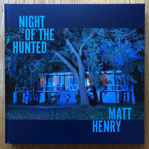 The photography book cover of Night of the Hunted by Matt Henry. Hardback in blue. Signed.