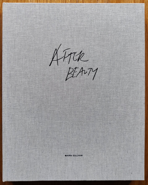 The photography book cover of After Beauty by Maura Sullivan. In hardcover grey. Signed