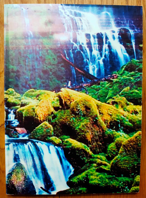 The photobook cover of The Fourth Wall by Max Pinckers. Paperback with a waterfall on the cover.