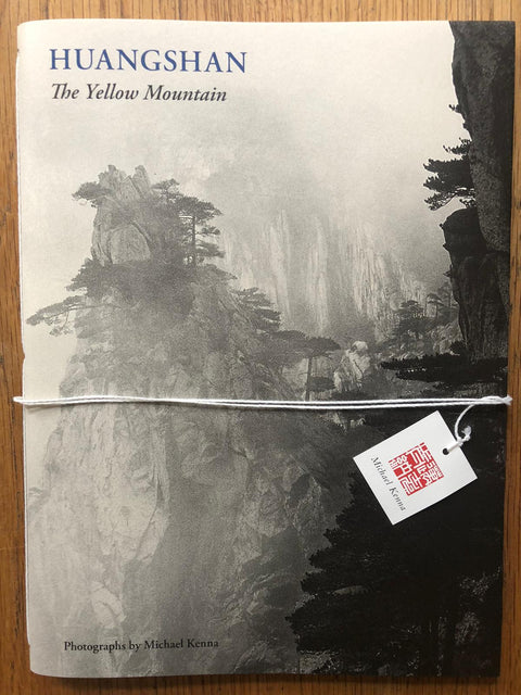 The photography book cover of Huangshan: The Yellow Mountain by Michael Kenna. Paperback with B&W image of trees on a cliff edge.